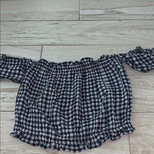 a blue and white plaid over the shoulder crop top